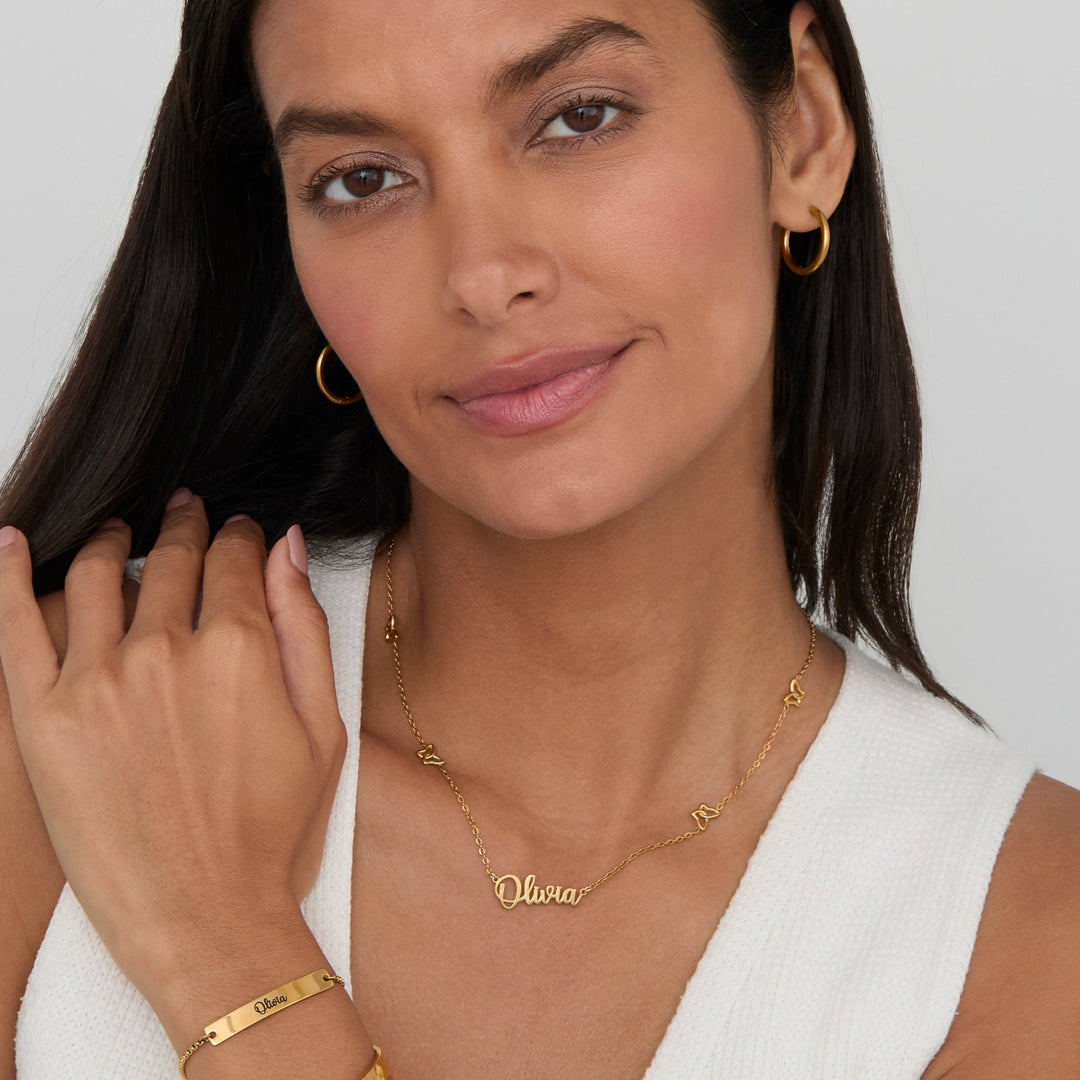 Gold Butterfly Name Necklace styled with a gold name bar bracelet — personalized gold jewelry.