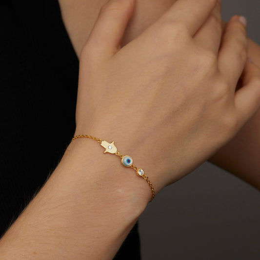 Close detail of the Gold Hamsa Hand Evil Eye Bracelet in 18K Gold Vermeil. Safe for sensitive skin, premium handmade jewelry.