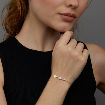 Macro detail of the Gold Hamsa Hand Evil Eye Bracelet showcasing craftsmanship in 18K Gold Vermeil. Tarnish-resistant.