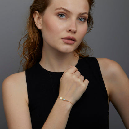 The Gold Hamsa Hand Evil Eye Bracelet styled in 18K Gold Vermeil — elegant everyday jewelry. Hypoallergenic, no green marks.