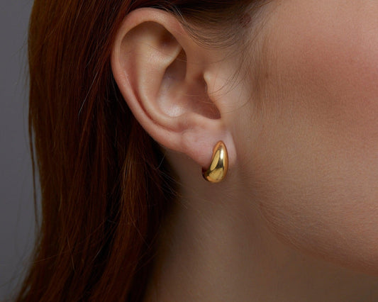 Close detail of the Gold Hinged Huggie Earrings in 18K Gold Vermeil. Tarnish-resistant, premium handmade jewelry.