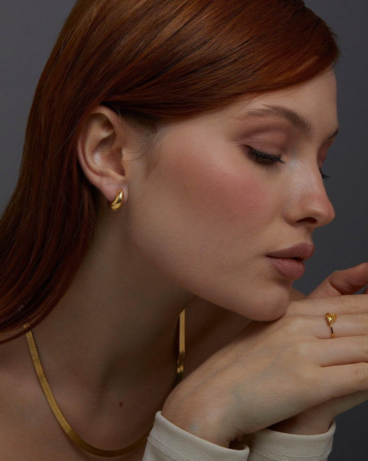 Macro detail of the Gold Hinged Huggie Earrings showcasing craftsmanship in 18K Gold Vermeil. No green marks, handmade.