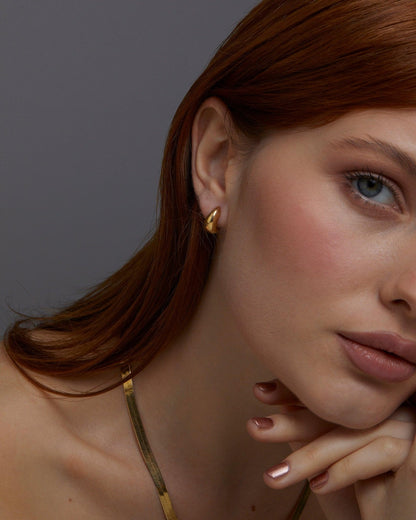 The Gold Hinged Huggie Earrings as an anniversary gift in 18K Gold Vermeil. Tarnish-resistant, made for keeping.