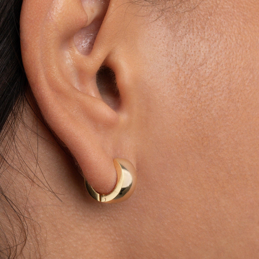 The Gold Huggie Hoop Earrings as a daily wear gift in Gold-Plated Steel. Tarnish-resistant, made for keeping.