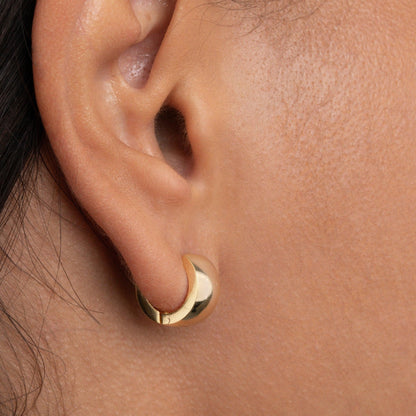 The Gold Huggie Hoop Earrings as a daily wear gift in Gold-Plated Steel. Tarnish-resistant, made for keeping.