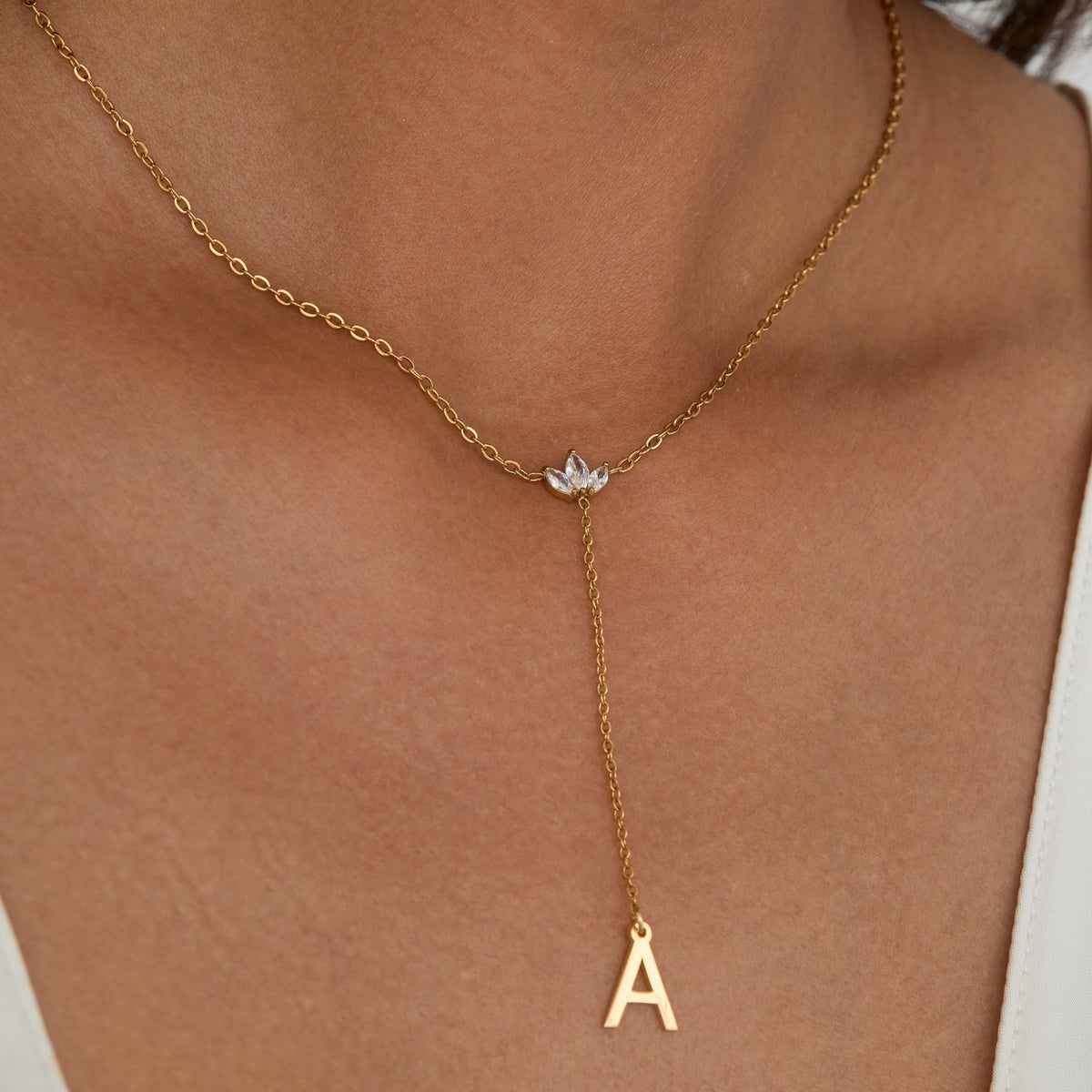 Macro detail of the Gold Initial Lariat Necklace showcasing craftsmanship in Gold-Plated Steel. Tarnish-resistant, handmade.