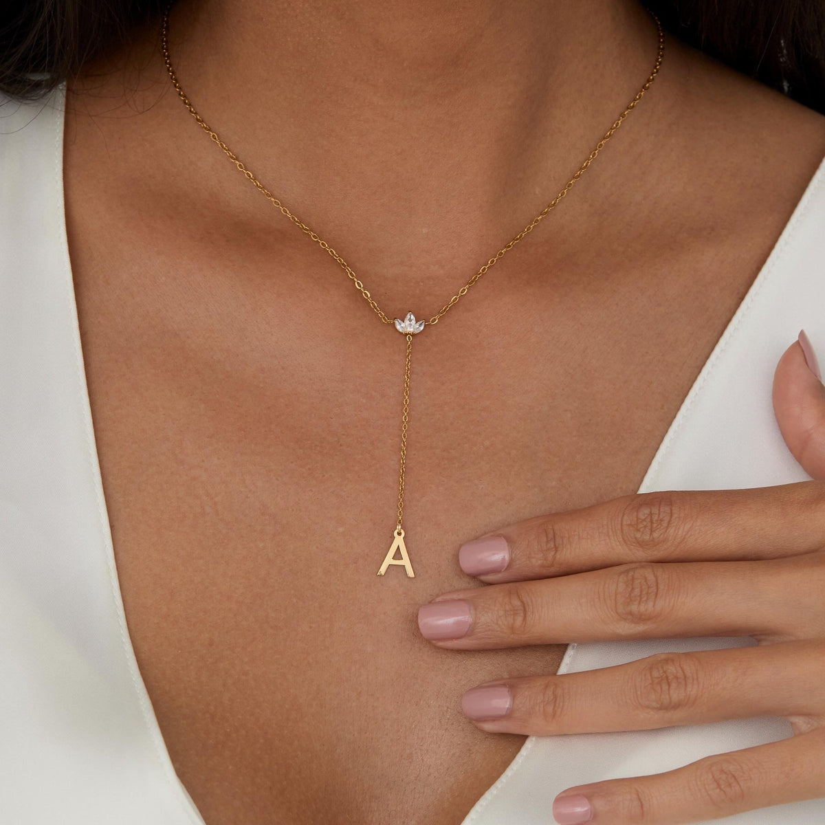 Gold Initial Lariat Necklace styled with complementary pieces in Gold-Plated Steel. Hypoallergenic, no green marks, layered.