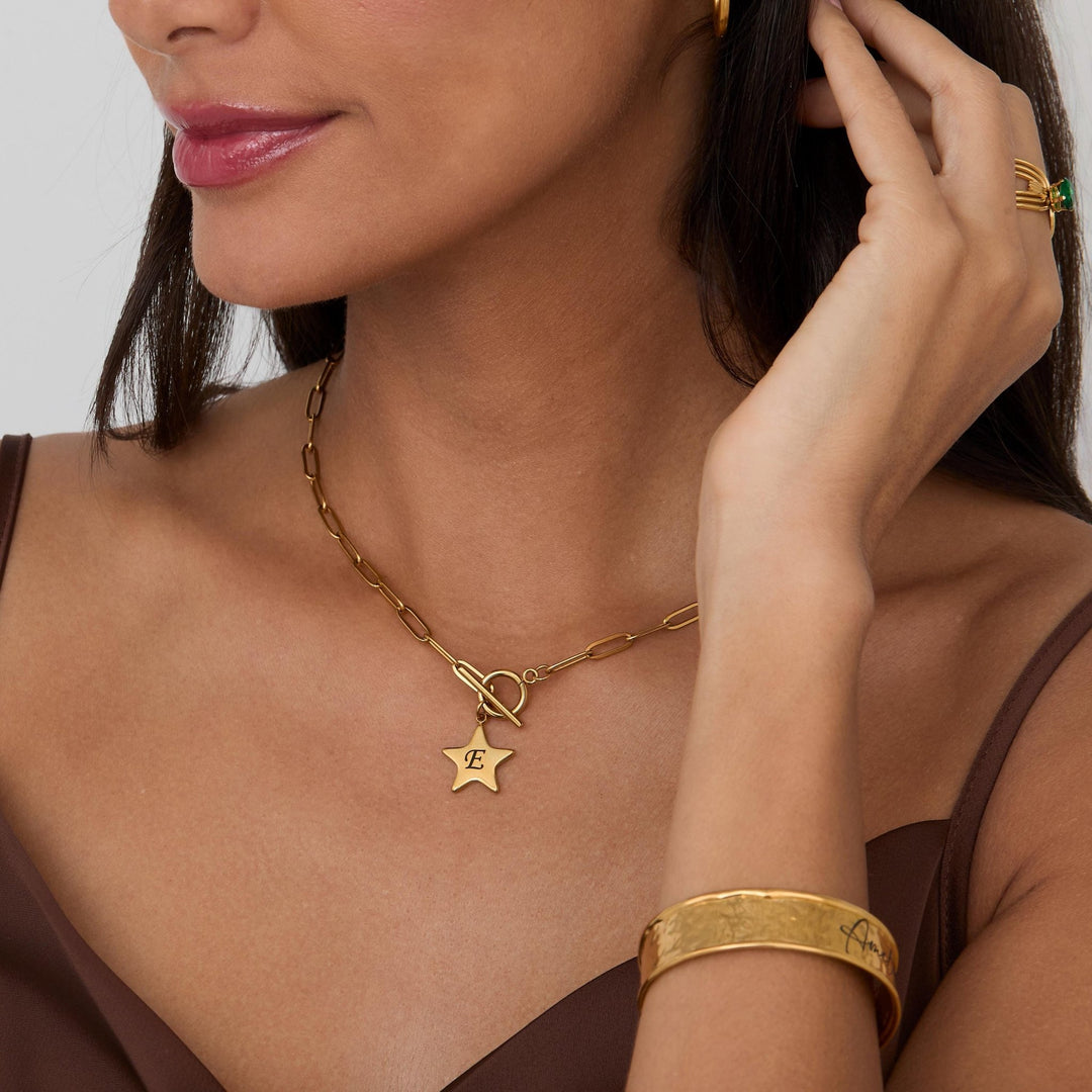 Macro detail of the Gold Star Necklace with Personalized Initial showcasing craftsmanship in Gold-Plated Steel.