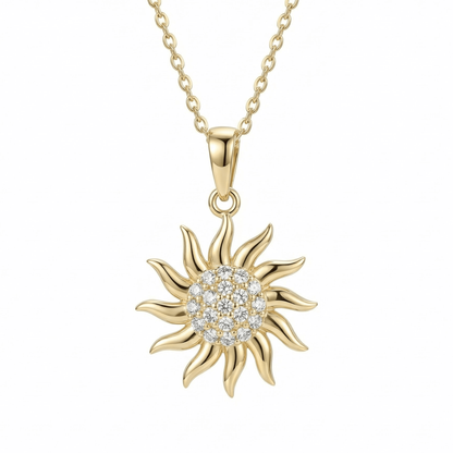 Gold Sun Necklace in 14K solid gold: a pavé cluster of 19 clear CZ stones ringed by wavy gold rays, on a fine chain.