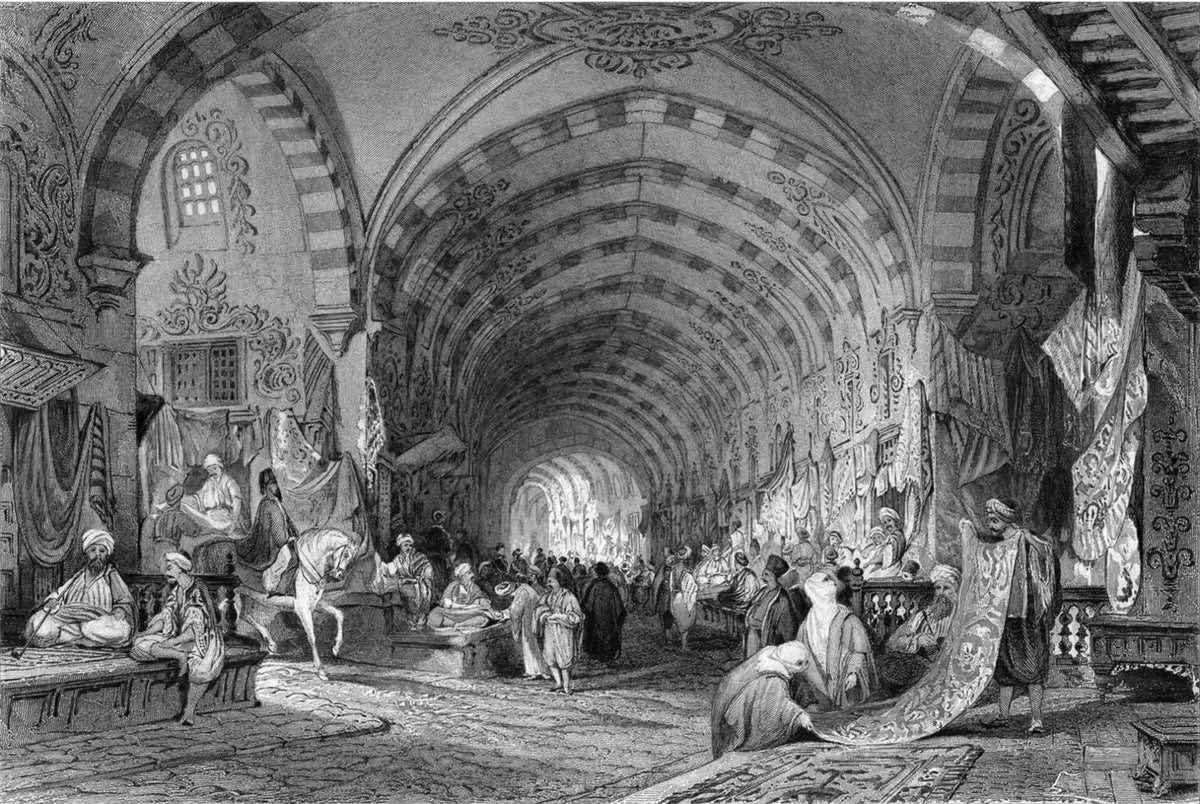 Antique engraving of the Grand Bazaar in Istanbul: merchants, shoppers and a rider on horseback beneath long painted stone arches