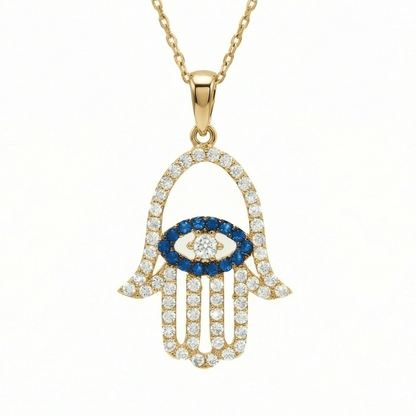Hamsa Necklace in 14K Solid Gold: an open hamsa hand paved in clear CZ, with a blue CZ evil eye in the palm, on a fine chain.