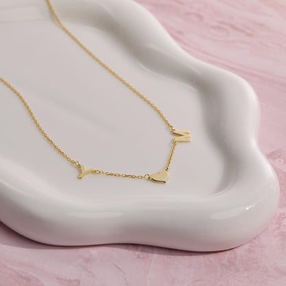 Heart and Initial Necklace as a thoughtful birthday gift in 18K Gold Vermeil. Hypoallergenic, no green marks.