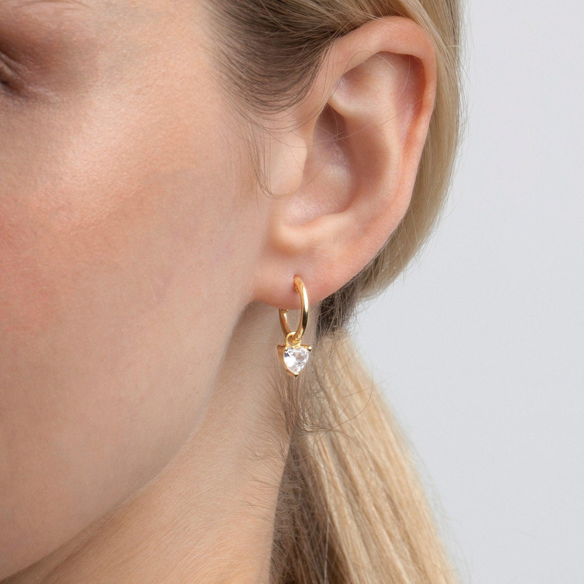 The Heart Diamond Earring styled in 18K Gold Vermeil — elegant everyday jewelry. Hypoallergenic for sensitive ears.