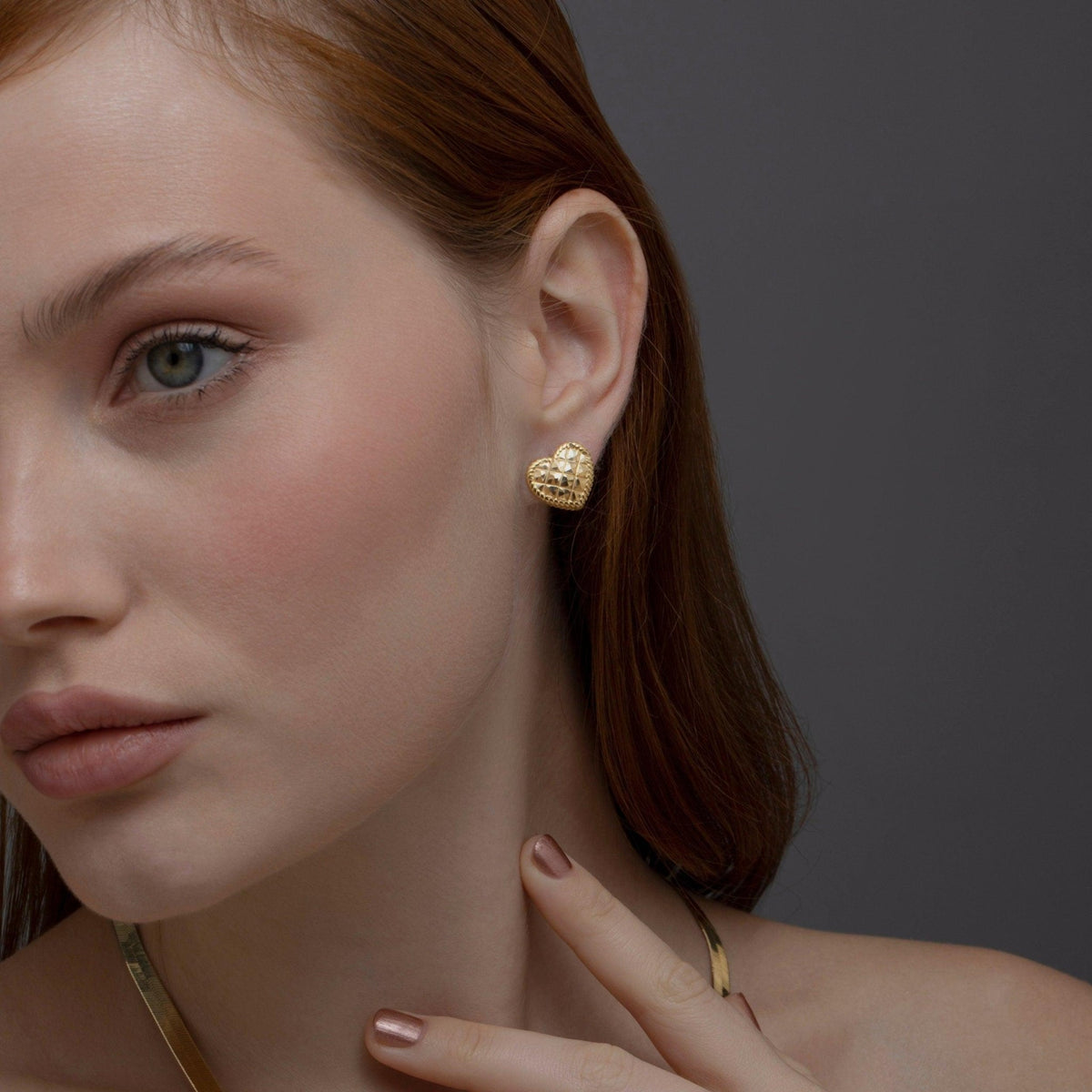 The Heart Earring worn in 18K Gold Vermeil — refined accessory for women. Tarnish-resistant.