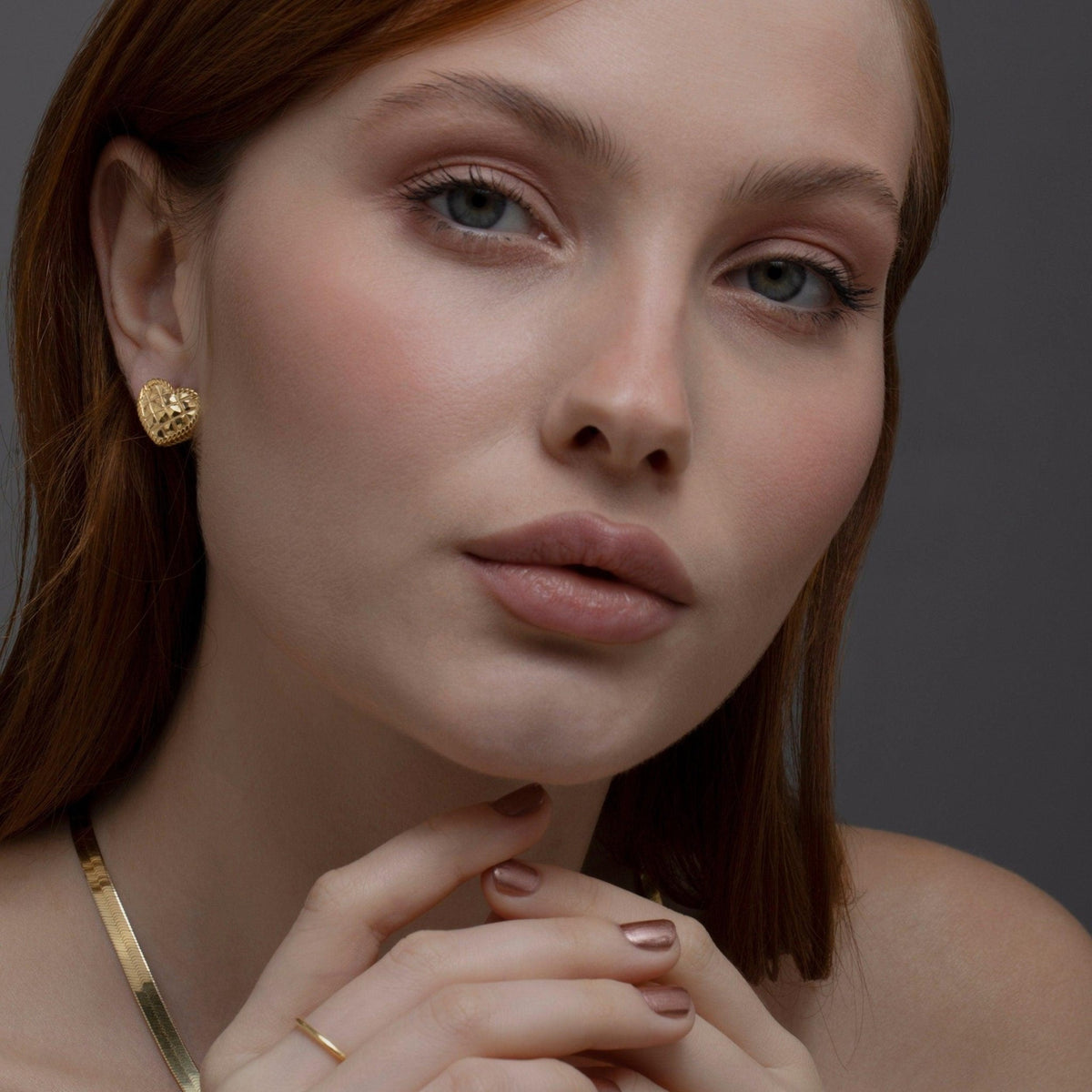 The Heart Earring styled in 18K Gold Vermeil — elegant everyday jewelry. Hypoallergenic for sensitive ears.