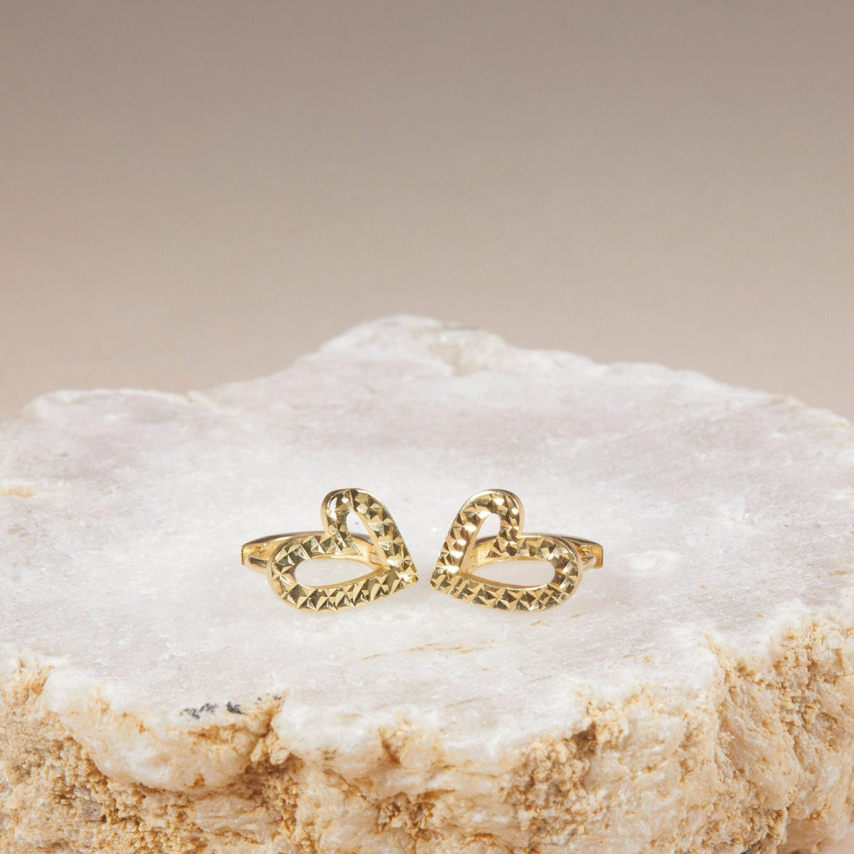 Macro detail of the Heart Hoop Earrings showcasing craftsmanship in 18K Gold Vermeil. No green marks, handmade.
