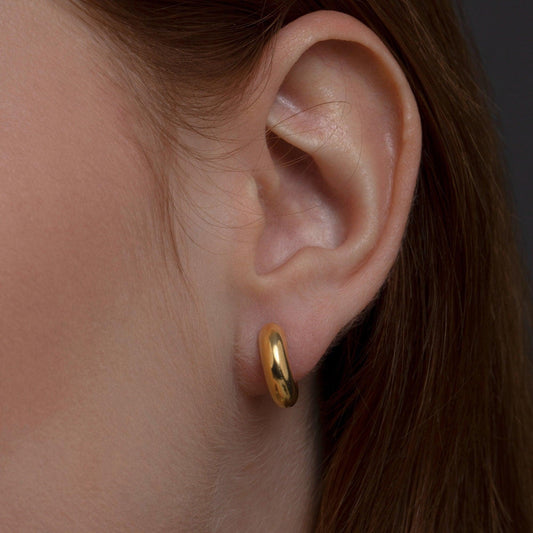 Close detail of the Huggie Hoops Hinged Earrings in 18K Gold Vermeil. Tarnish-resistant, premium handmade jewelry.