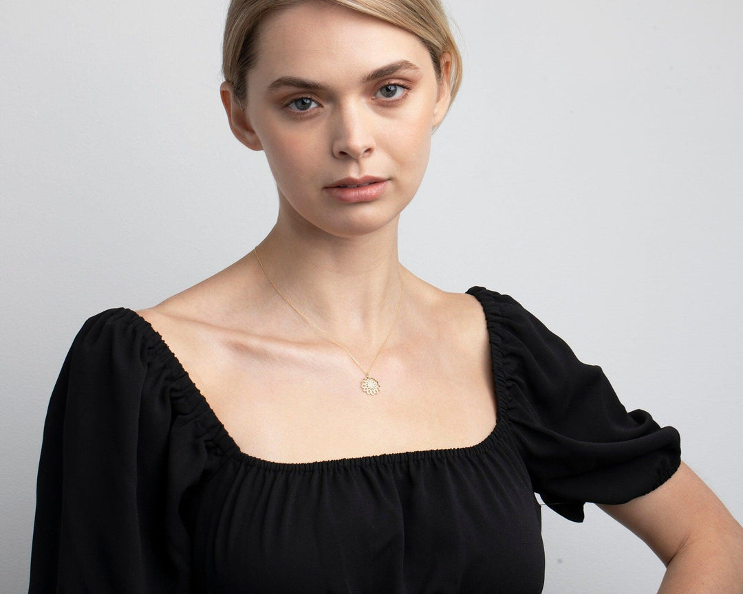 The Lotus Flower Necklace styled in 18K Gold Vermeil — elegant everyday jewelry. Hypoallergenic, no green marks.