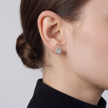 Woman in a black band-collar blouse wearing a lotus natural diamond cluster stud earring in 14K white gold, side profile