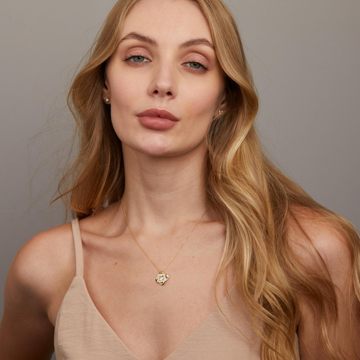 The Love Knot Necklace styled in 18K Gold Vermeil — elegant everyday jewelry. Tarnish-resistant.