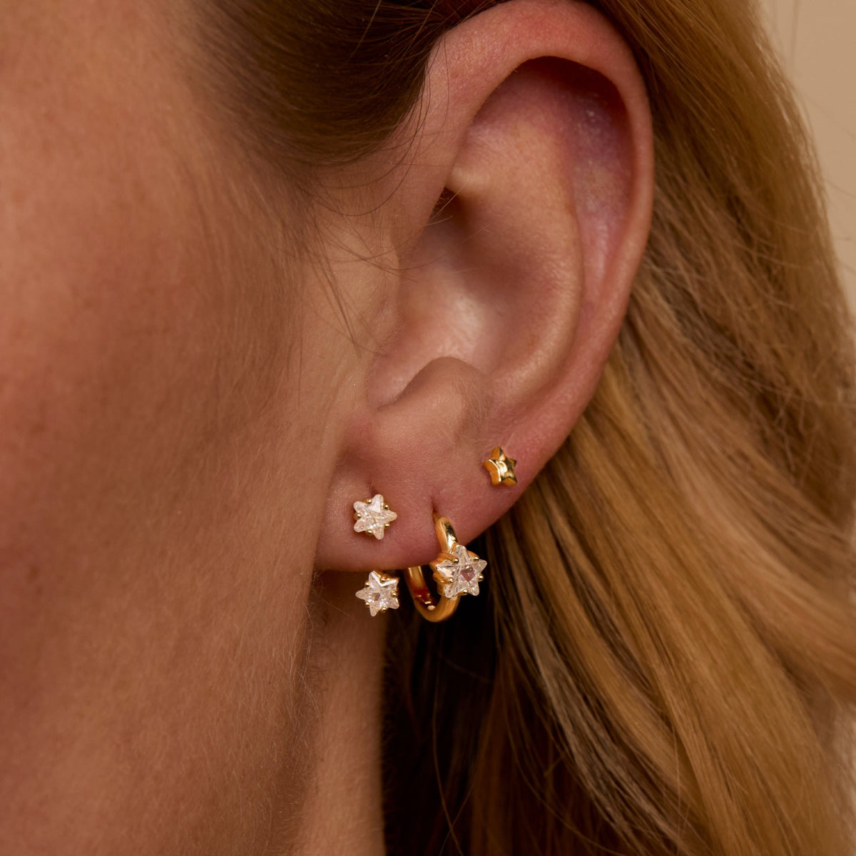 Star Ear Jacket Hoop Earring Set styled with complementary pieces in 18K Gold Vermeil. Hypoallergenic for sensitive ears.