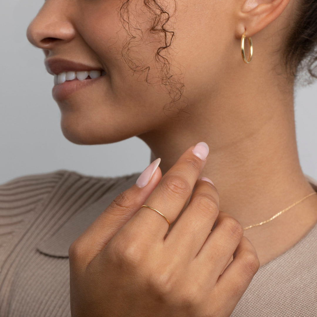 The Minimal Band Ring styled in 18K Gold Vermeil — elegant everyday jewelry. Tarnish-resistant.