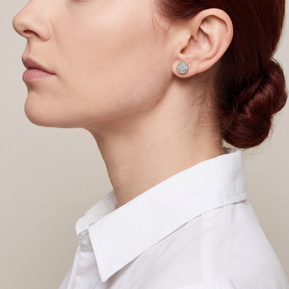 Second model wearing the diamond cluster stud earring in clean profile