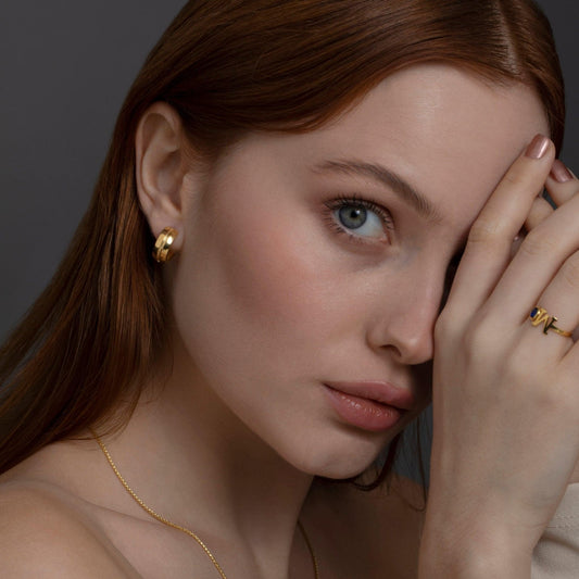 Close detail of the Modern Huggie Hoop Earrings in 18K Gold Vermeil. Tarnish-resistant, premium handmade jewelry.