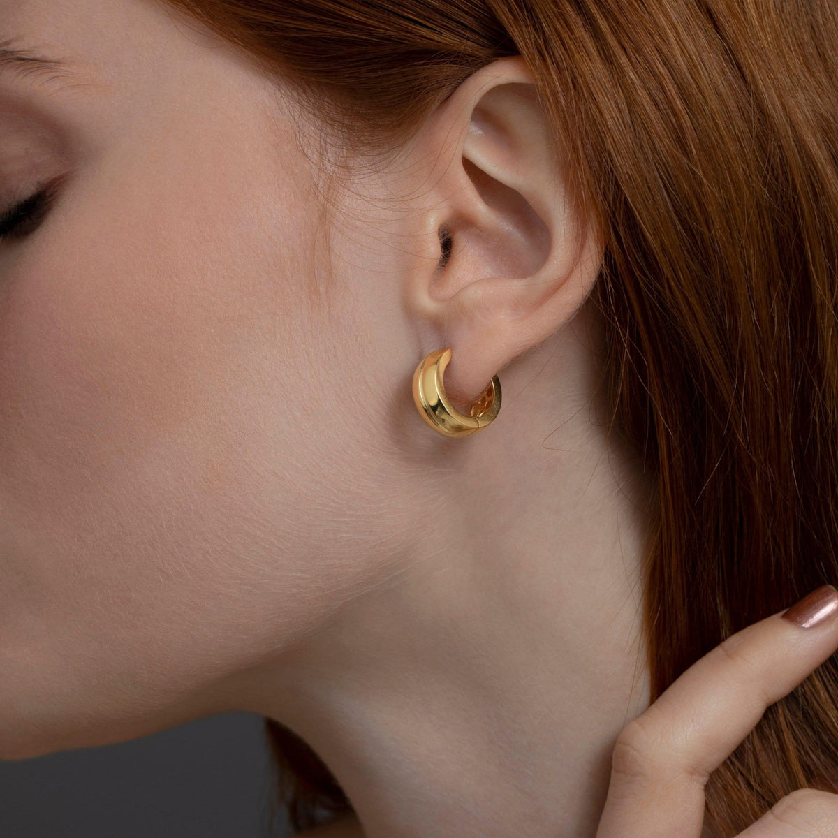 Macro detail of the Modern Huggie Hoop Earrings showcasing craftsmanship in 18K Gold Vermeil. No green marks, handmade.
