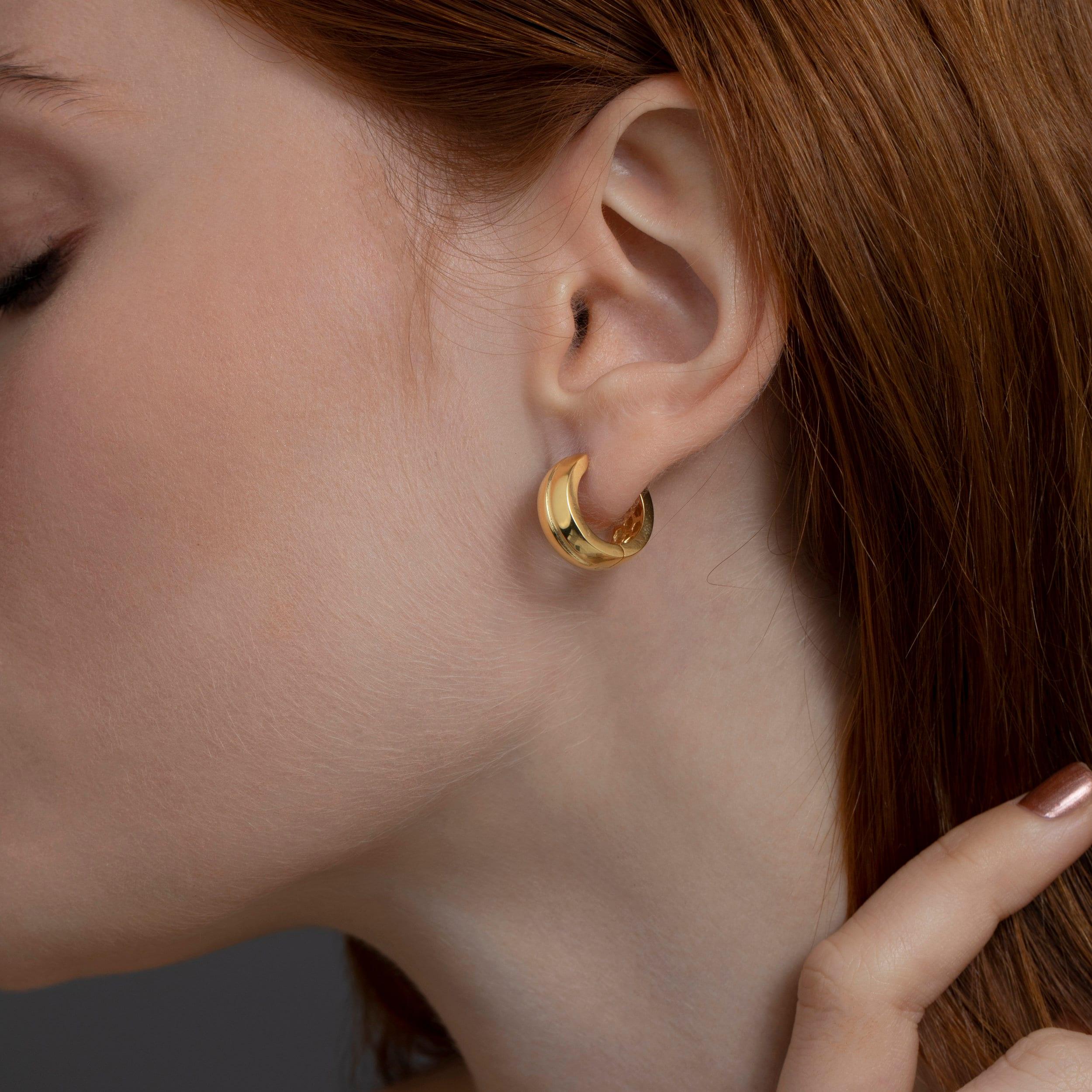 Macro detail of the Modern Huggie Hoop Earrings showcasing craftsmanship in 18K Gold Vermeil. No green marks, handmade.