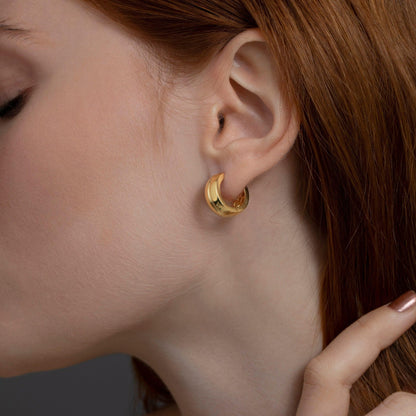Macro detail of the Modern Huggie Hoop Earrings showcasing craftsmanship in 18K Gold Vermeil. No green marks, handmade.