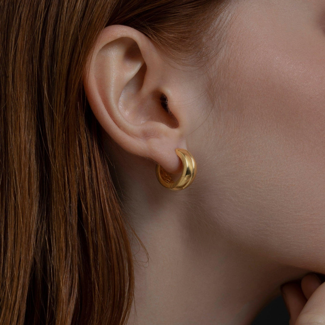 Modern Huggie Hoop Earrings as a thoughtful birthday gift in 18K Gold Vermeil. Hypoallergenic for sensitive ears.