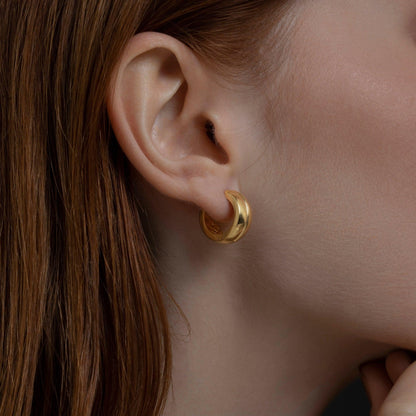 Modern Huggie Hoop Earrings as a thoughtful birthday gift in 18K Gold Vermeil. Hypoallergenic for sensitive ears.