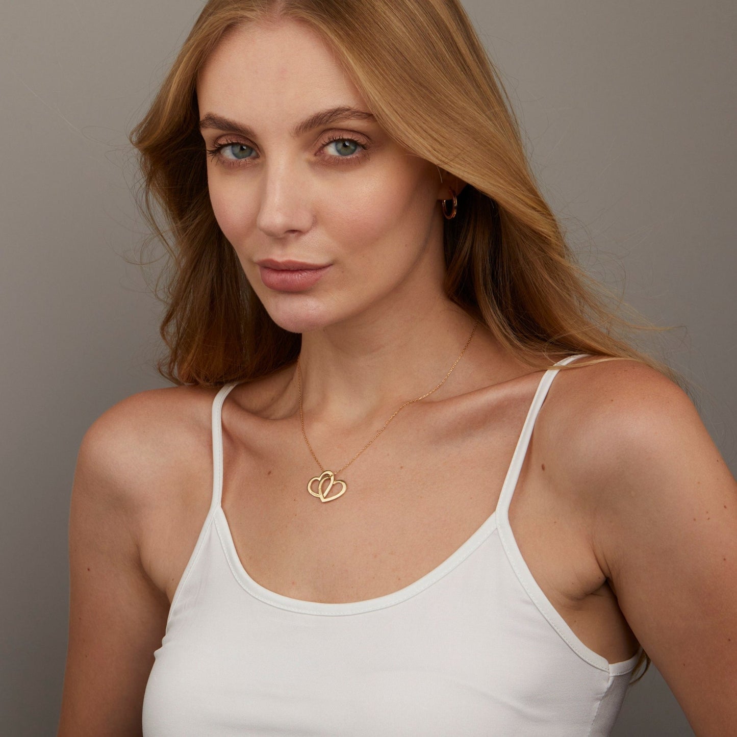 The Multi-Heart Name Necklace styled in 18K Gold Vermeil — elegant everyday jewelry. Hypoallergenic, no green marks.
