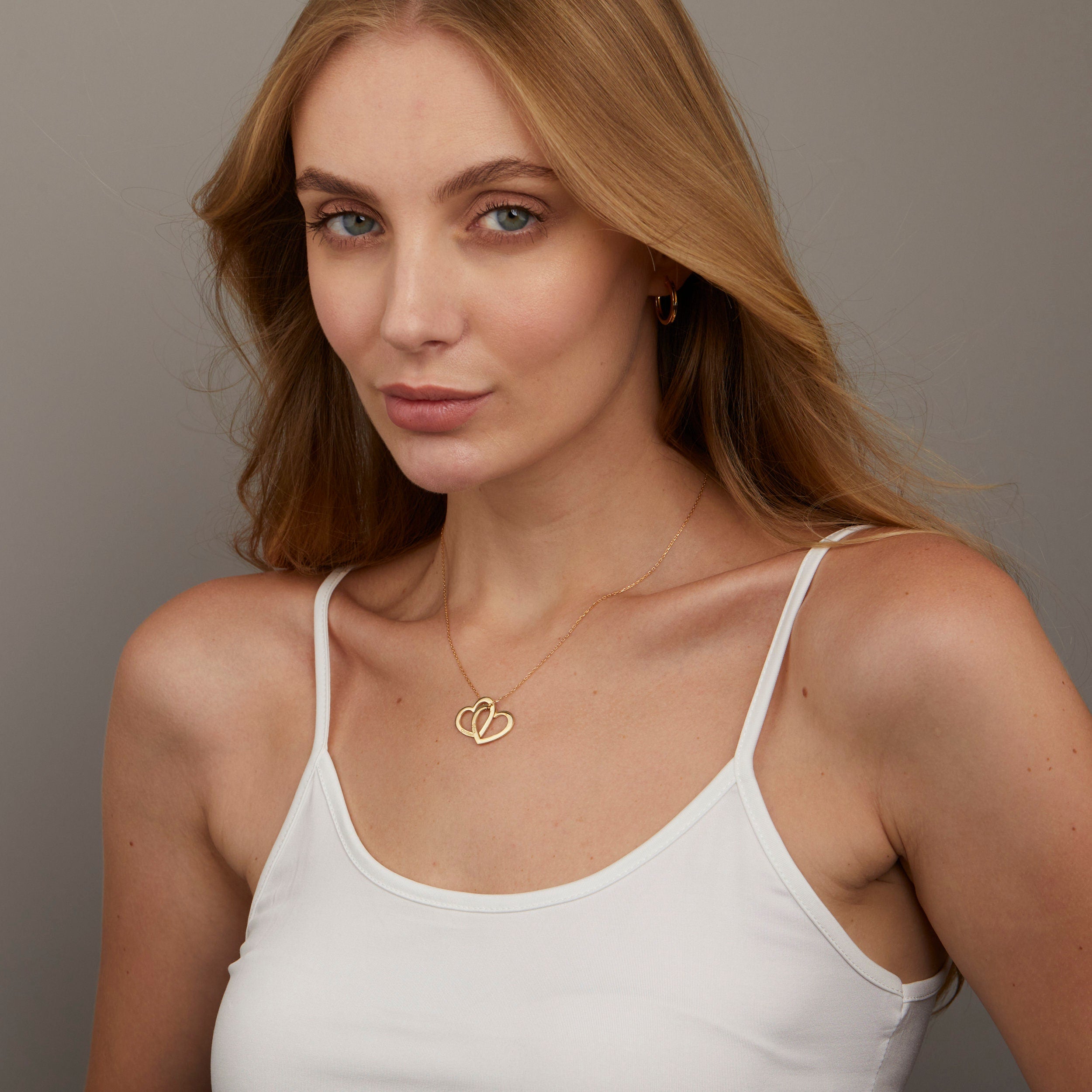 The Multi-Heart Name Necklace styled in 18K Gold Vermeil — elegant everyday jewelry. Hypoallergenic, no green marks.