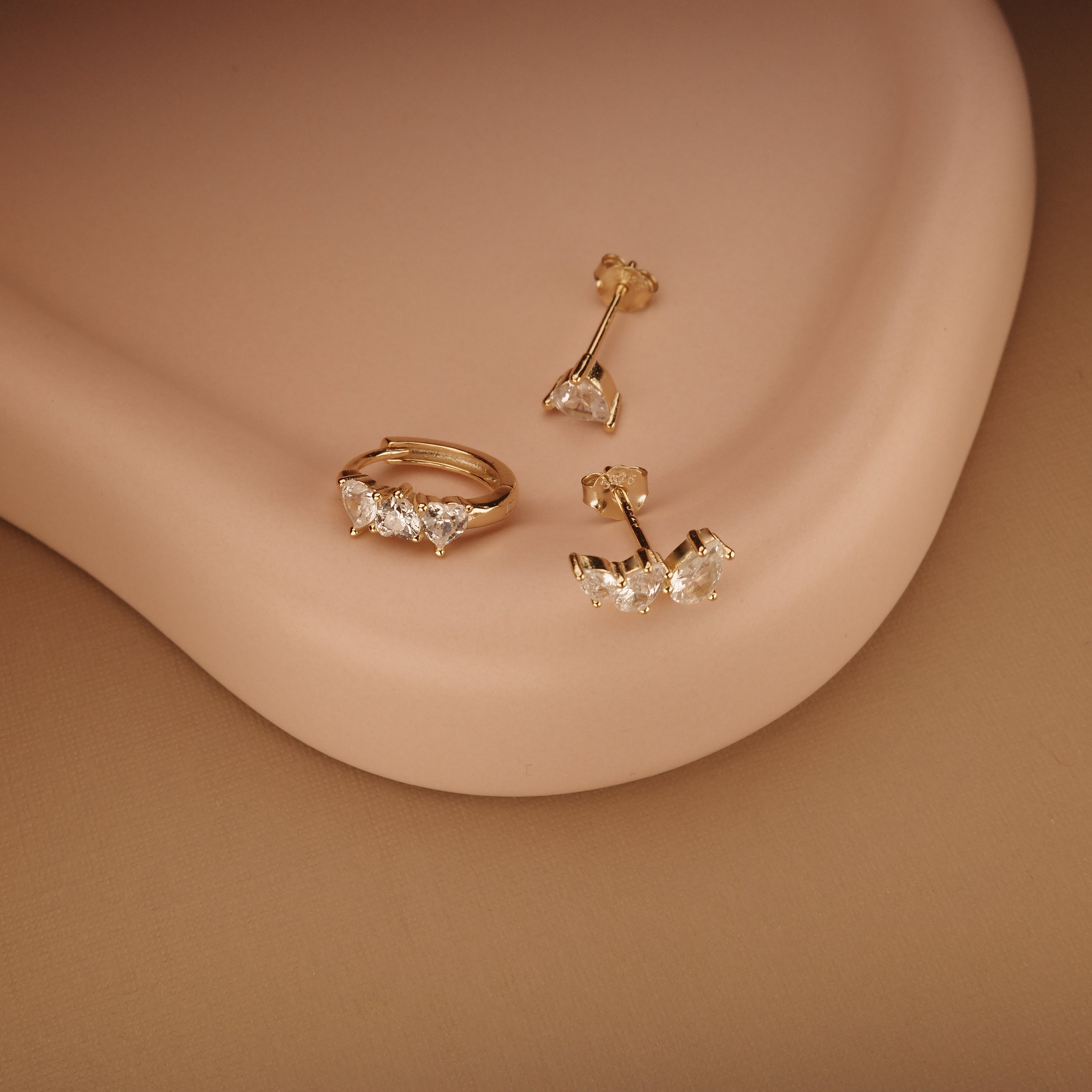 Multi-Pearl Glam Ear Cluster styled with complementary pieces in 18K Gold Vermeil. Hypoallergenic for sensitive ears.