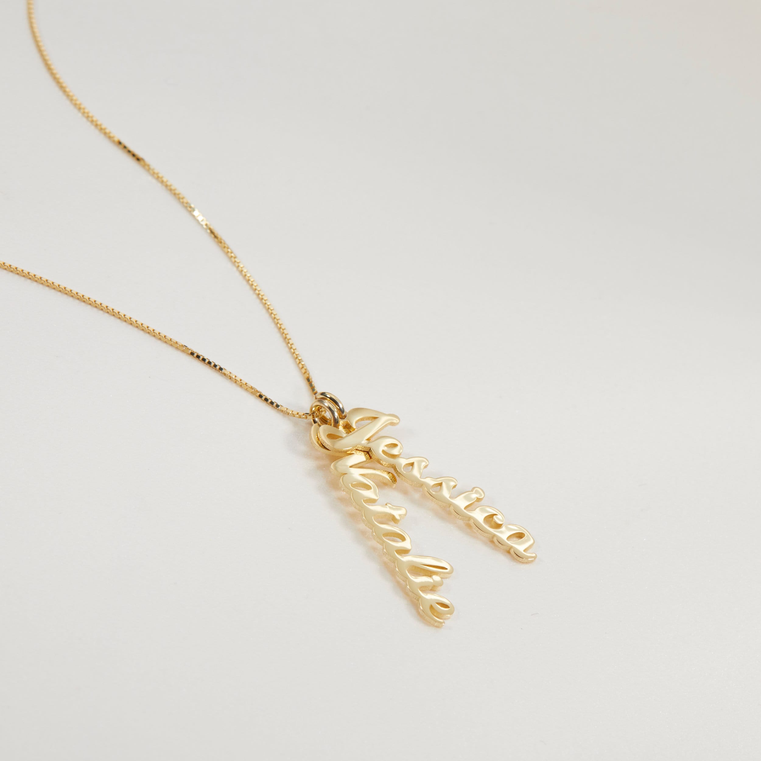 Multiple Vertical Name Necklace as a thoughtful birthday gift in 18K Gold Vermeil. Hypoallergenic, no green marks.