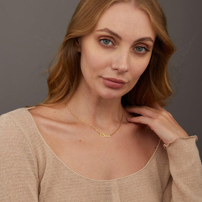 Name Necklace styled with complementary pieces in 18K Gold Vermeil. Hypoallergenic, no green marks, layered looks.