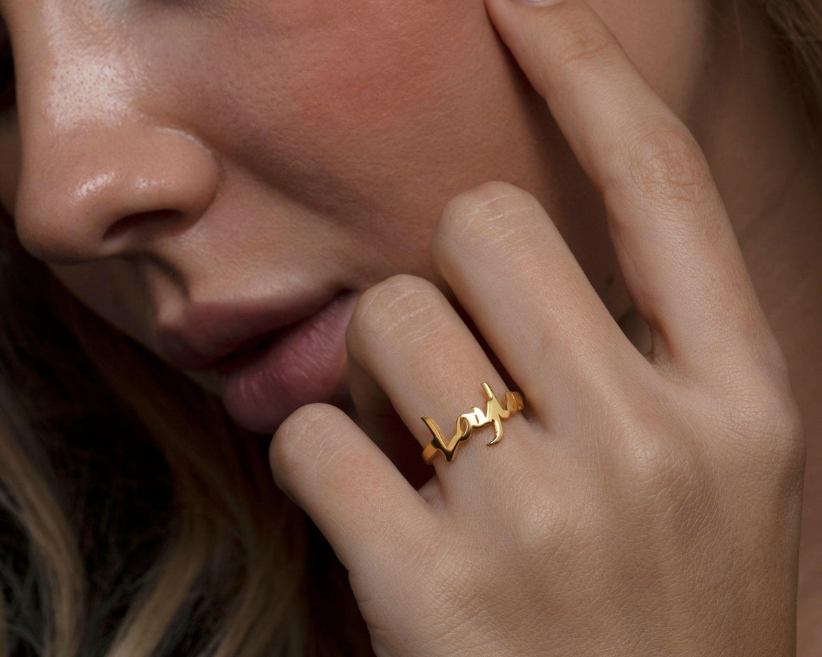 The Name Ring as an anniversary gift in 18K Gold Vermeil. Tarnish-resistant, made for keeping.