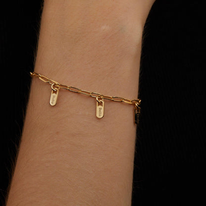 The Name Tag Bracelet with Paperclip Chain worn in 18K Gold Vermeil — refined accessory for women. Safe for sensitive skin.