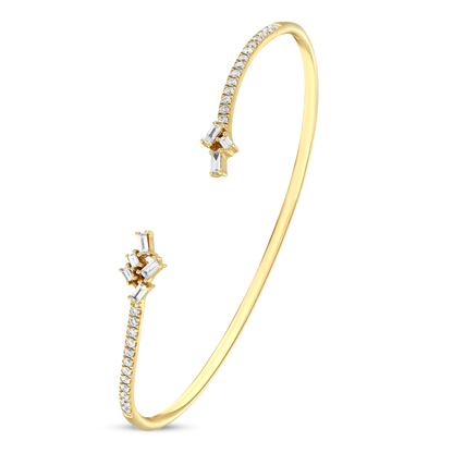18K yellow gold open cuff bracelet with natural baguette and round diamonds, angled view
