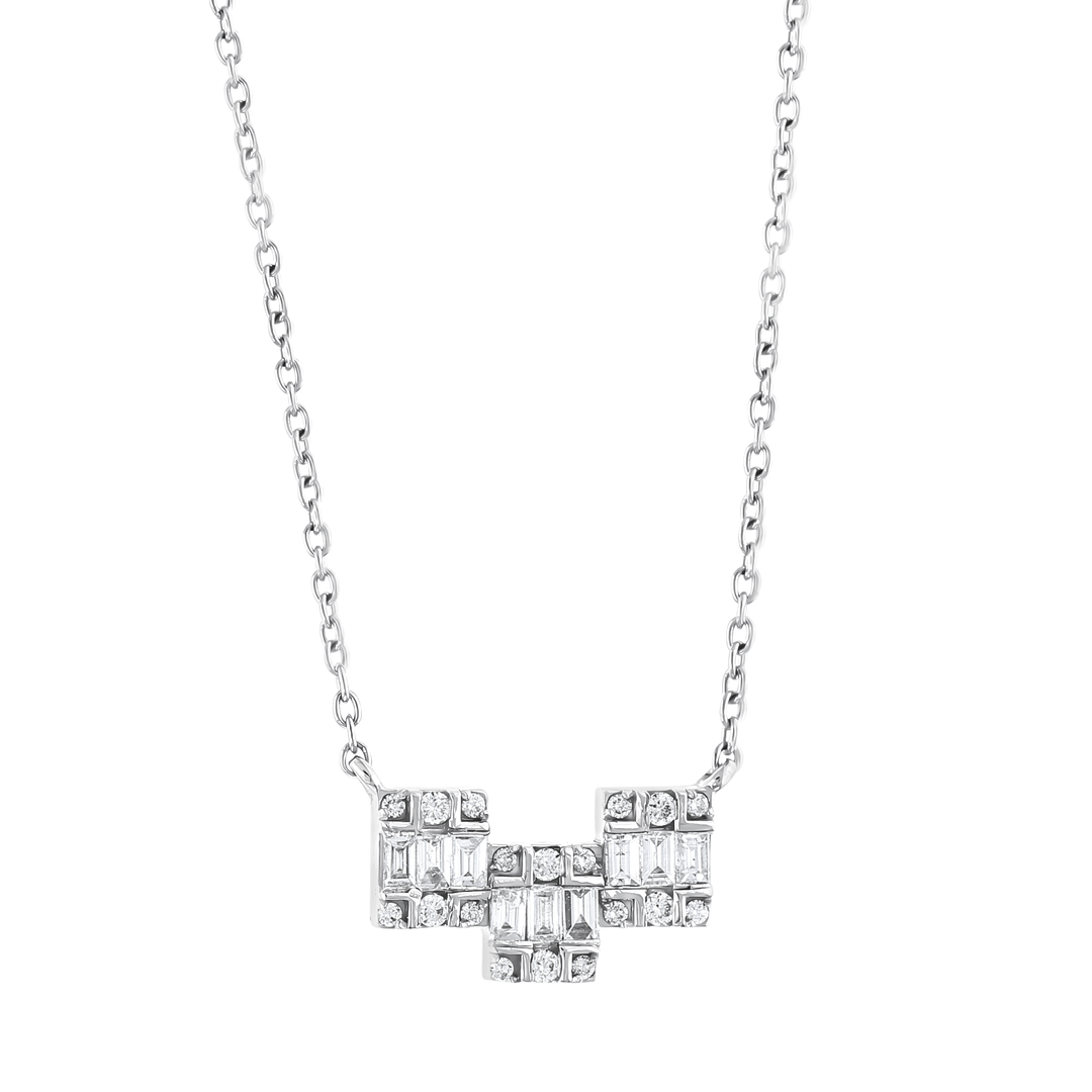 Close-up of the three stepped blocks of baguette and round natural diamonds in 18K white gold
