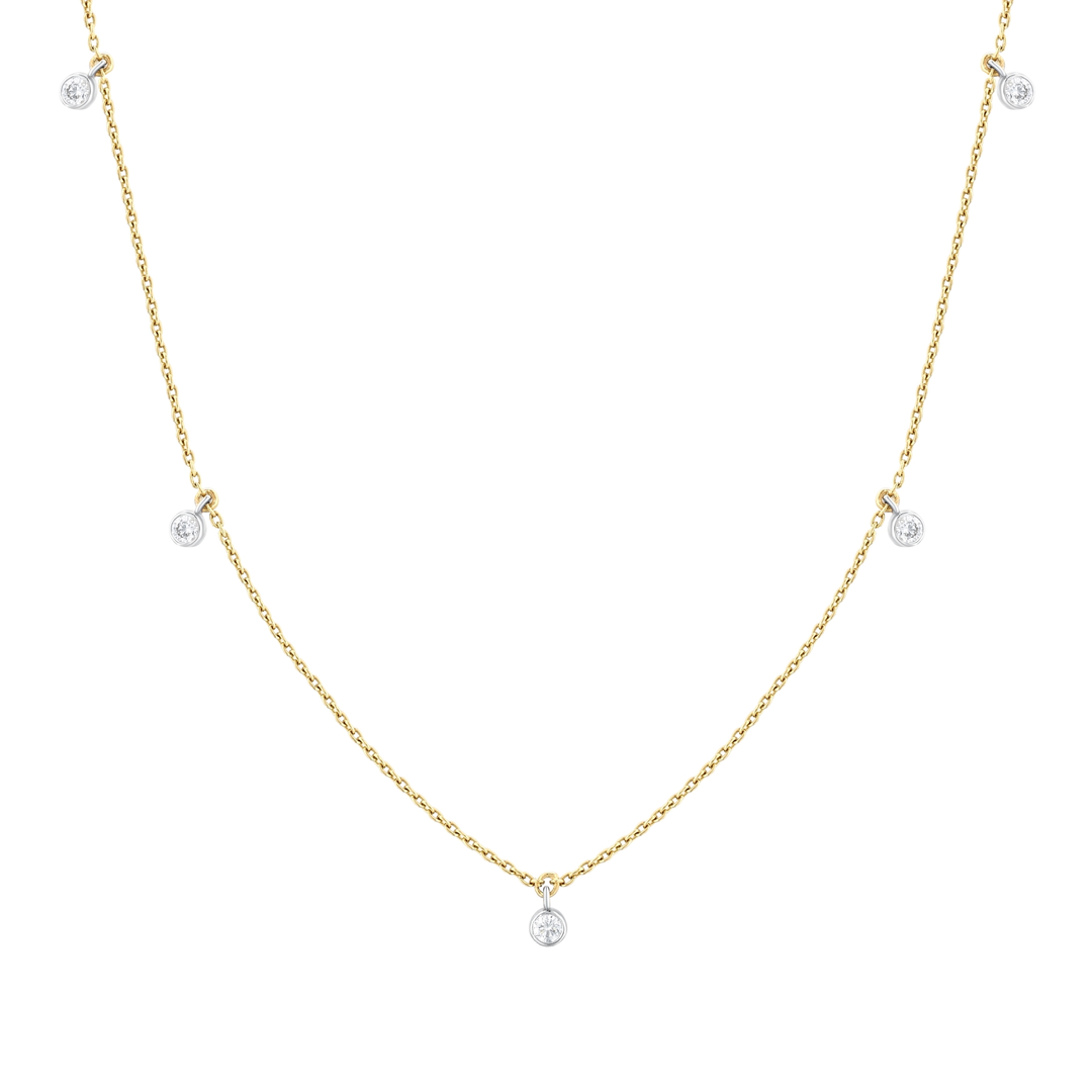 Close view of five natural diamonds in white-gold bezels on a 14K yellow-gold cable chain
