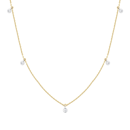 Close view of five natural diamonds in white-gold bezels on a 14K yellow-gold cable chain