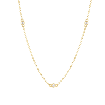 Close-up of the bezel-set natural diamond stations on the 14K yellow gold cable chain
