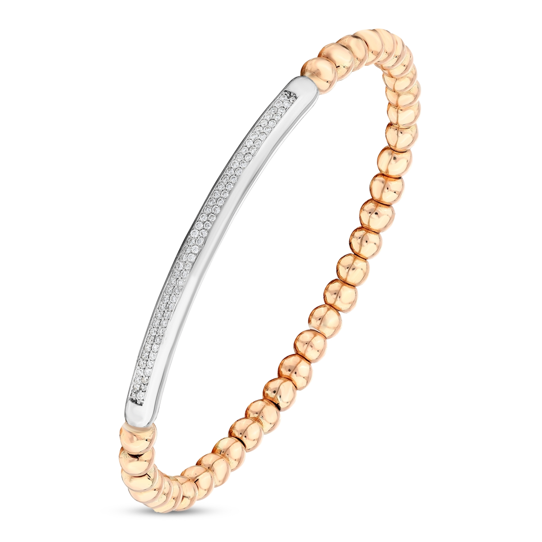 Close-up of the white-gold bar set with two rows of natural pavé diamonds between 14K rose-gold beads
