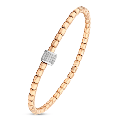 Close-up of the 14K white-gold barrel paved with natural diamonds on the rose-gold bead bracelet