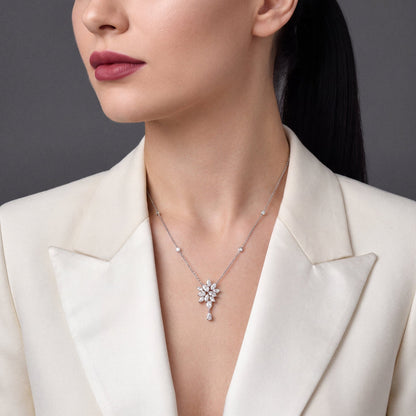 2.59 ct natural diamond cluster drop necklace in 18K white gold, worn with an ivory tuxedo jacket