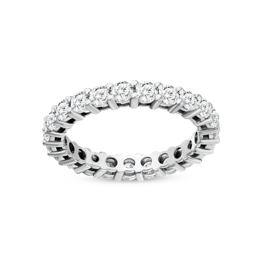 Natural diamond full eternity band in 14K white gold lying flat, the row of shared-claw round brilliants facing the camera