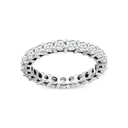 Natural diamond full eternity band in 14K white gold lying flat, the row of shared-claw round brilliants facing the camera